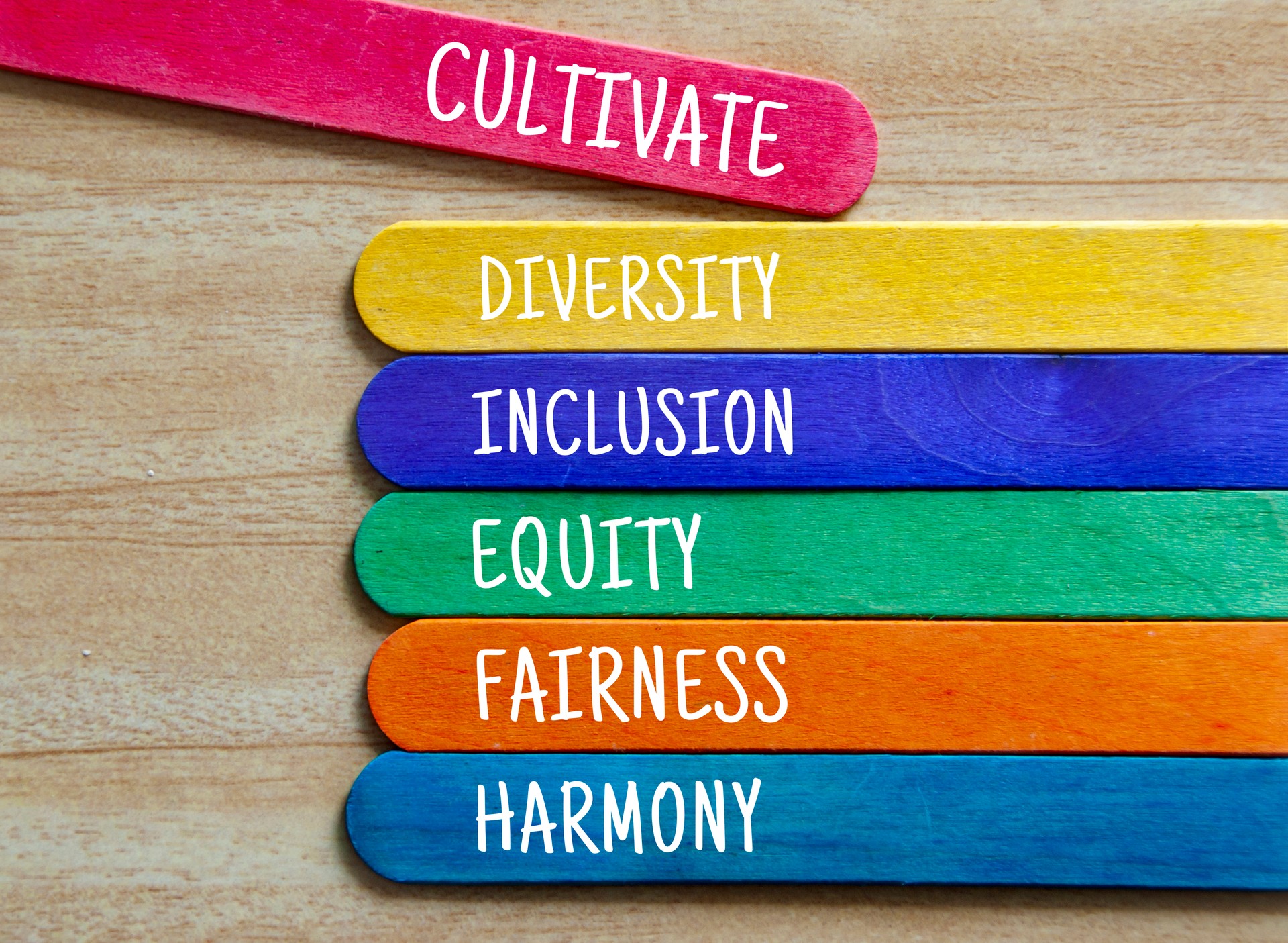 Cultivate diversity, inclusion, equality, fairness and harmony text on colorful wooden stick. Business culture concept